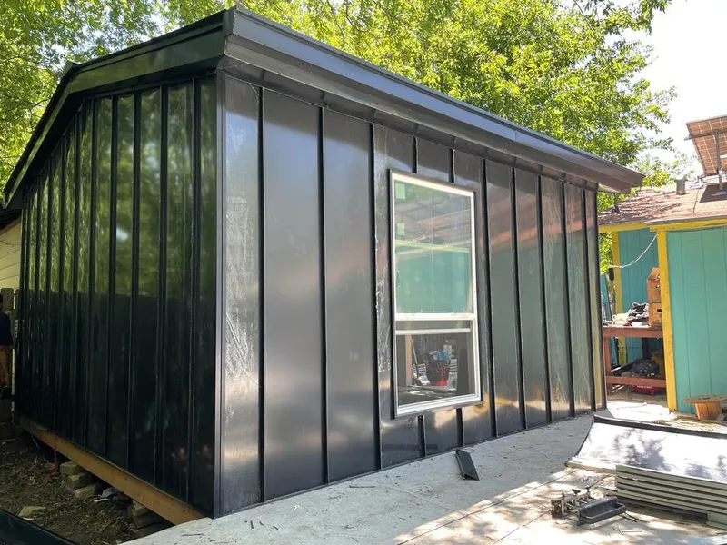 Black standing seam metal wall panels for Metal Roof Installation in Wheatfield