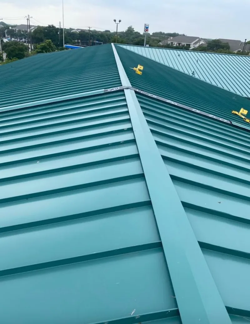 Green commercial metal roof ridge and valley for Metal Roof Repair in Wheatfield